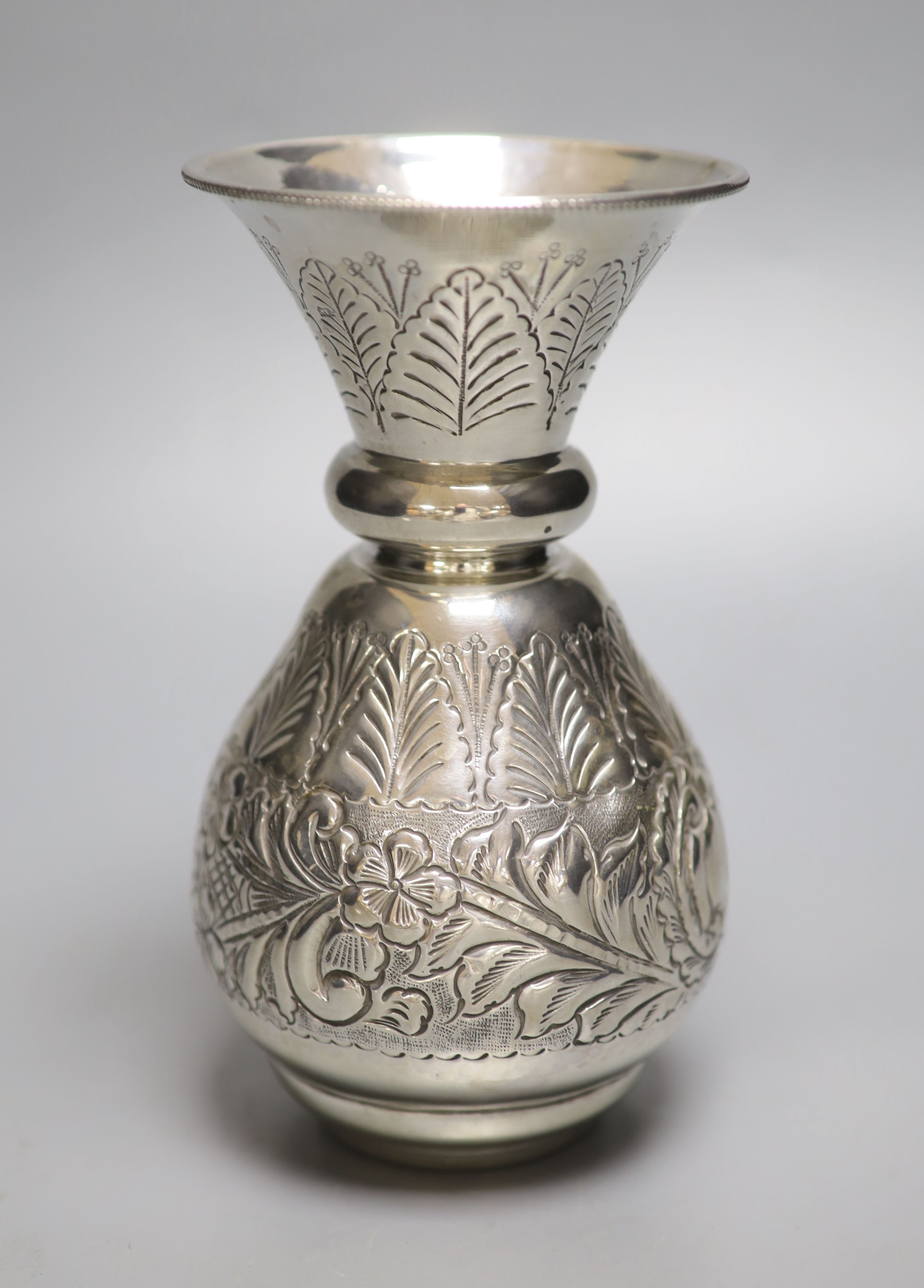 A post 1946 Egyptian embossed white metal baluster vase, 17.5cm,